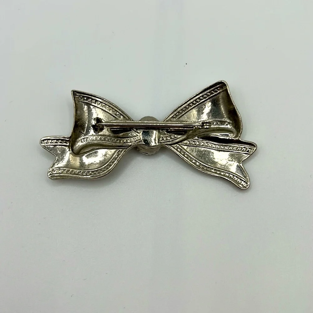 Silver Tone Bow Brooch with Black Center